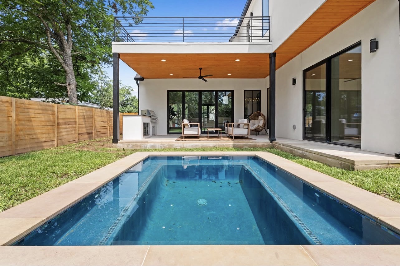 Backyard pool and covered patio photograph by JEFF in Austin, Texas