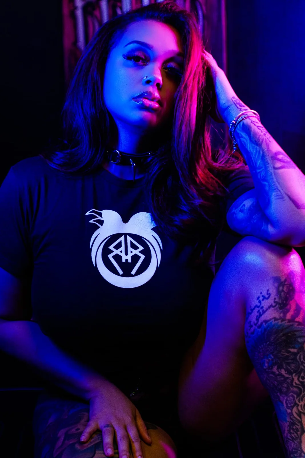 Creative studio portrait with blue and magenta lighting photographed by JOHN