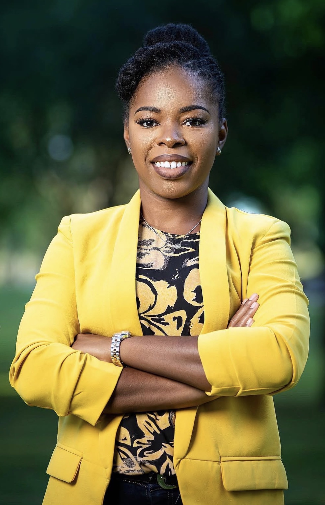 Outdoor branding portrait of a woman in a yellow blazer