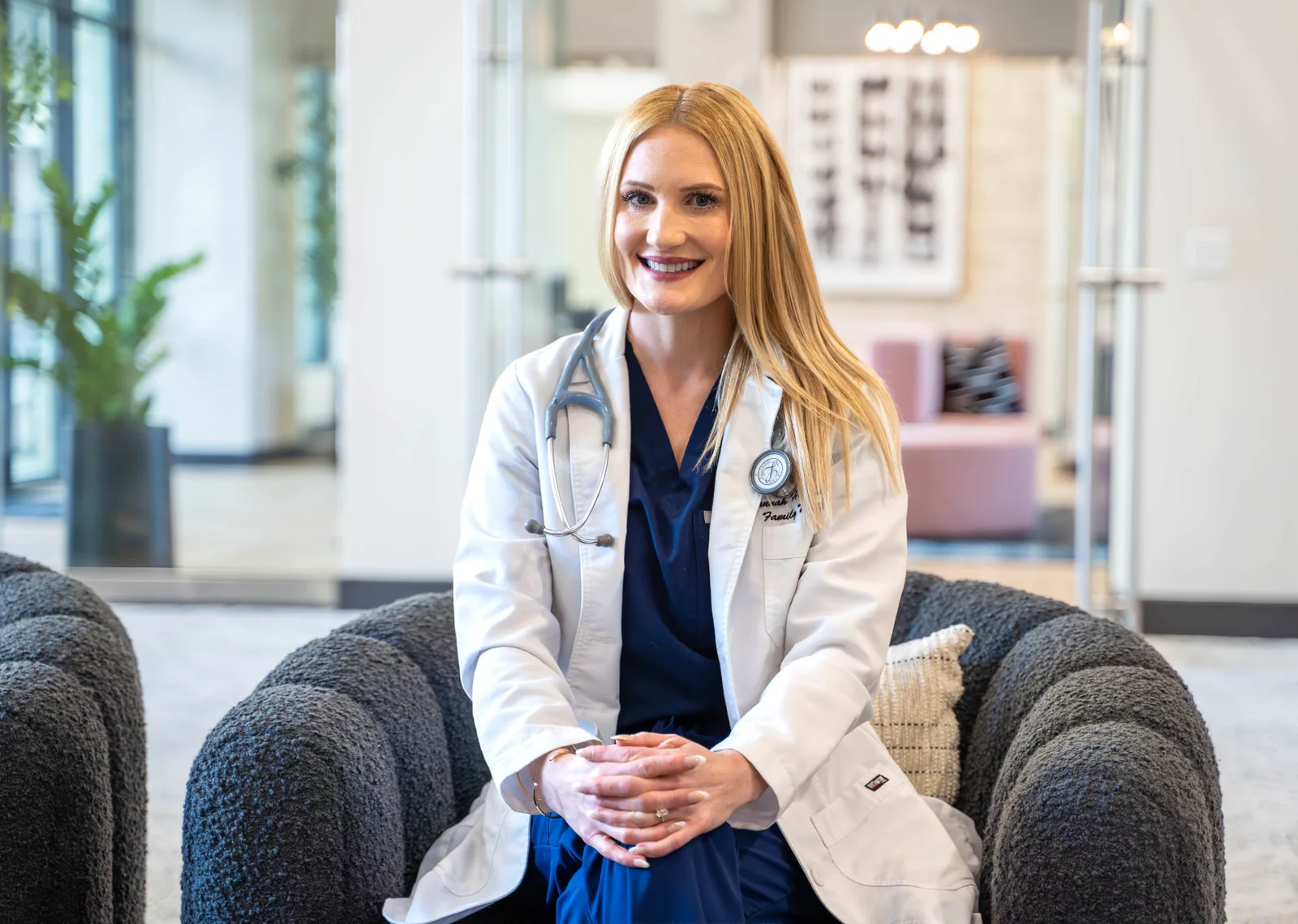 Healthcare professional seated for a polished branding portrait